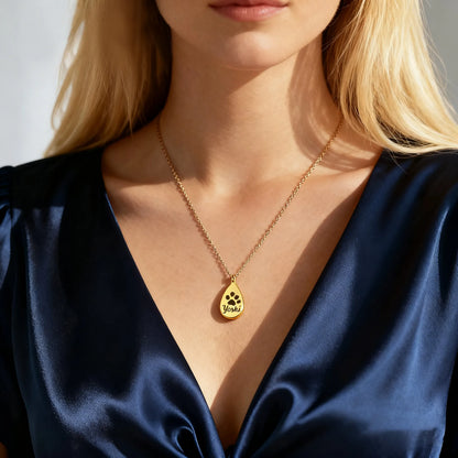 Model wearing gold teardrop pet ashes urn necklace — custom engraved memorial pendant