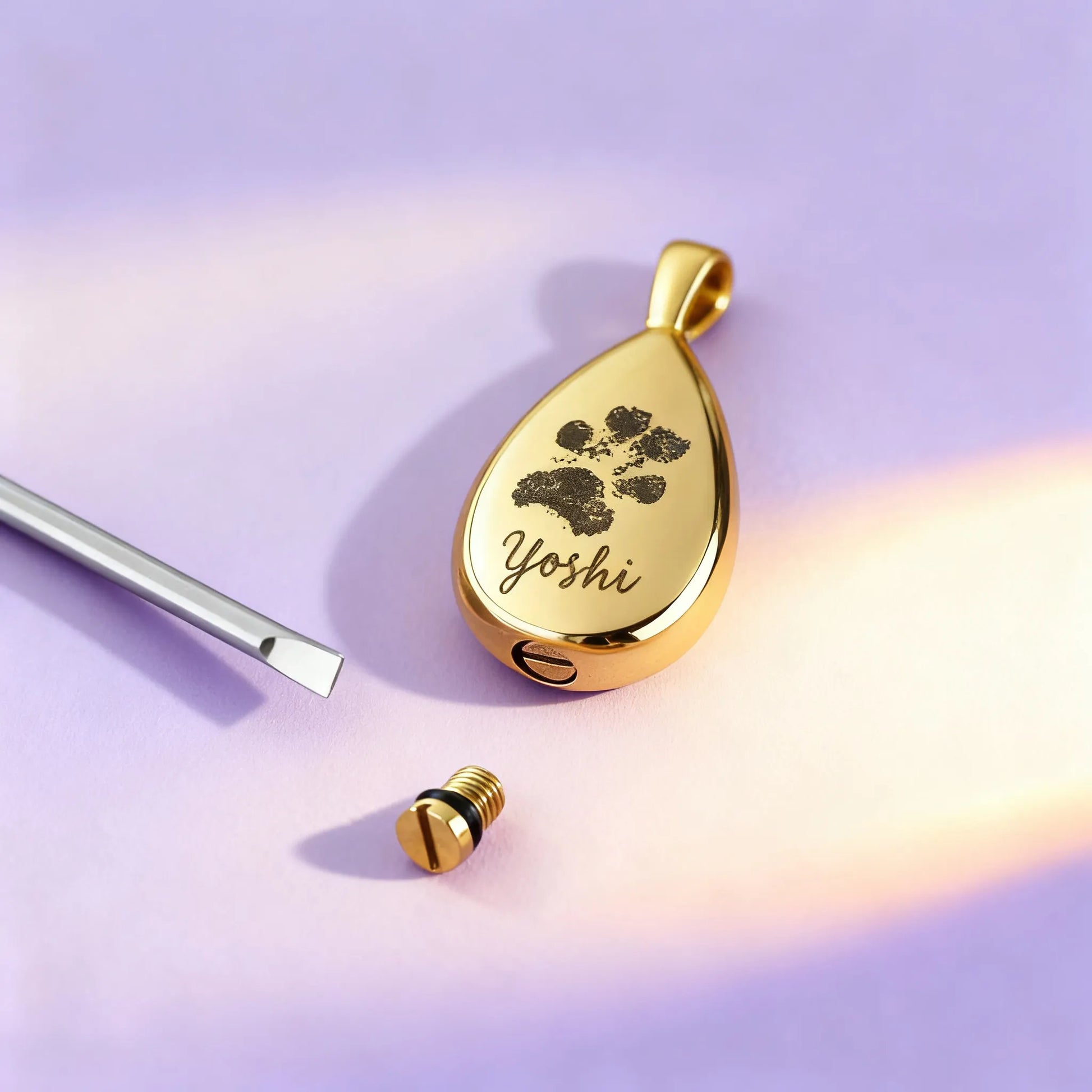 Filling a teardrop pet cremation necklace with ashes — mini funnel and screw cap detail
