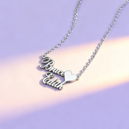Silver personalized two-name heart nameplate necklace on chain, minimalist background