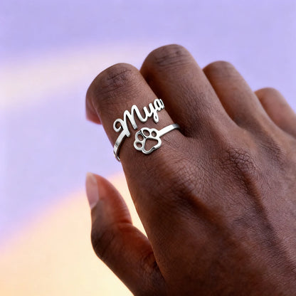 Custom name ring with paw print on hand — sterling-silver adjustable pet lover jewelry