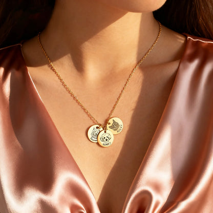 Model wearing gold custom pet portrait coin necklace with two engraved discs