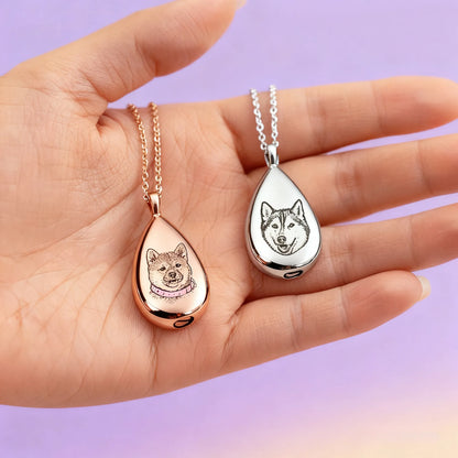Hand holding silver and rose-gold teardrop pet ashes necklaces — photo portrait options
