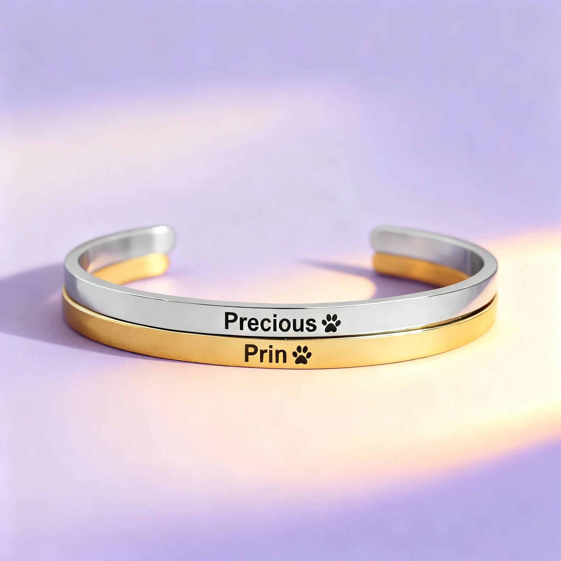 open cuff with “Precious” & paw print custom engraving