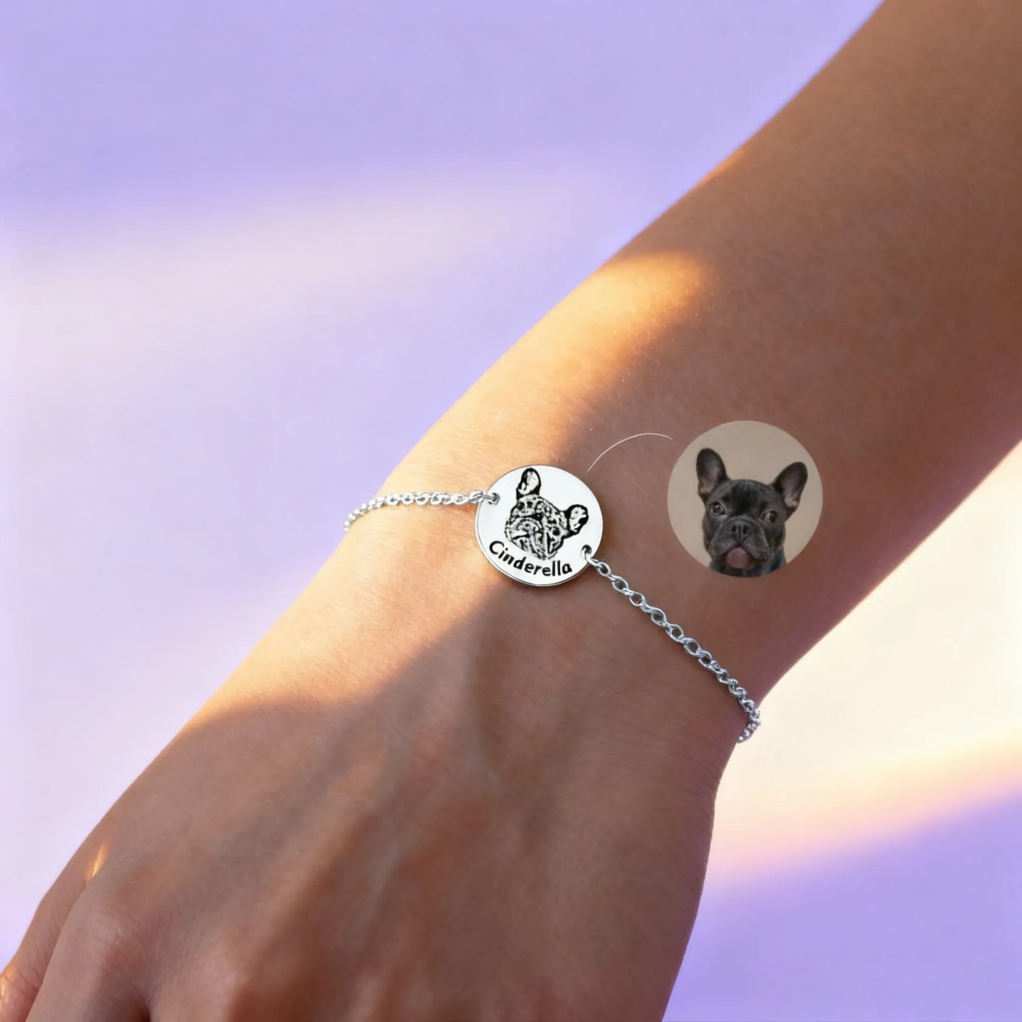 Silver chain bracelet with two round custom pet charms (cat & dog) on wrist