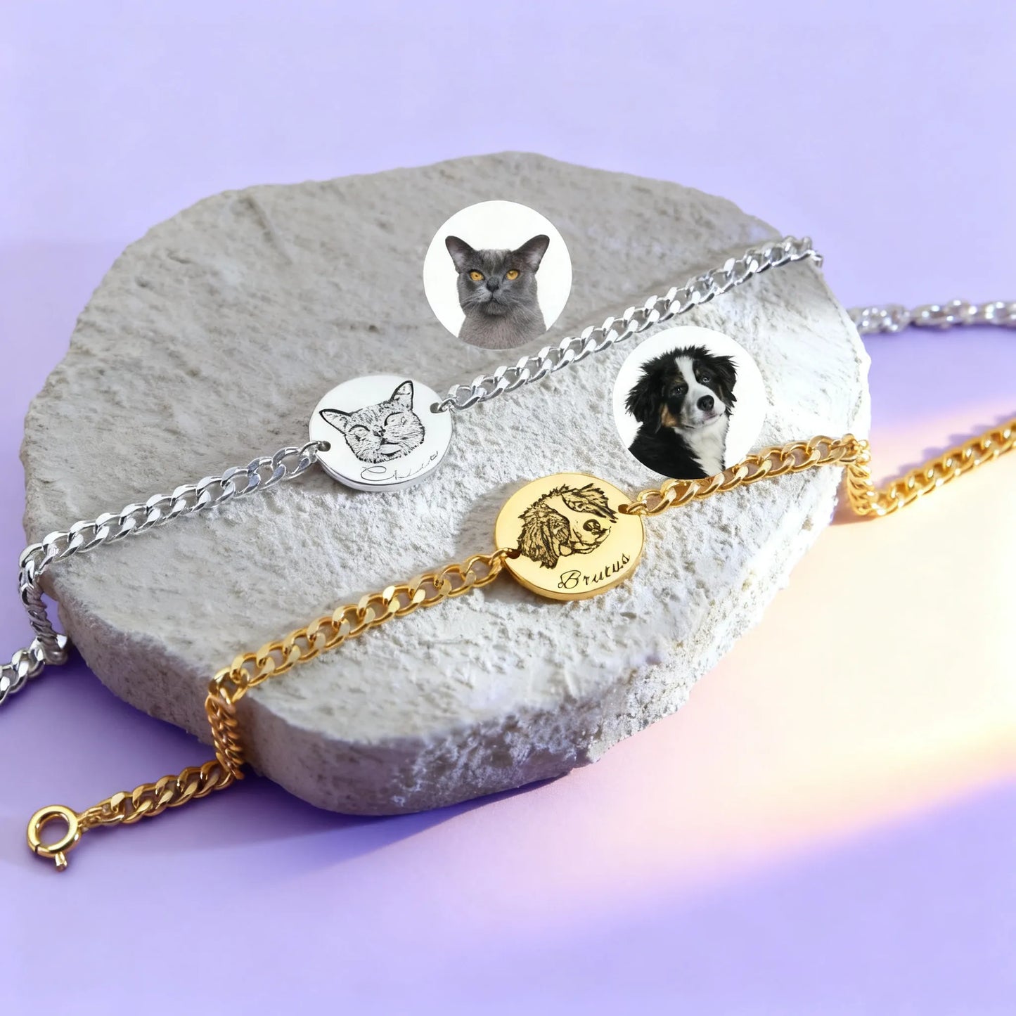 Close-up of gold and silver personalized pet photo coin bracelets on stone display