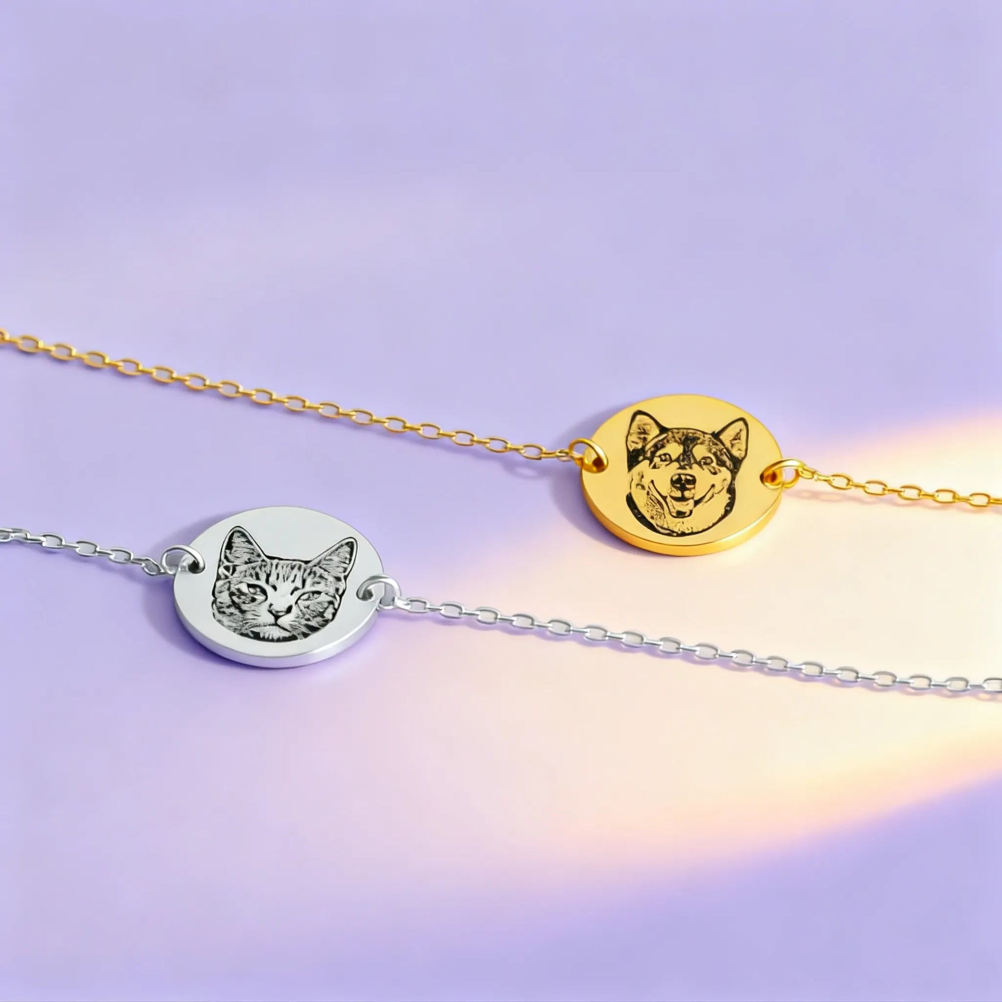 Close-up of gold and silver custom pet face coin bracelets on pastel background